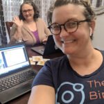 Dr. Robin Elise Weiss and Dr. Hillary Melchiors sitting at table