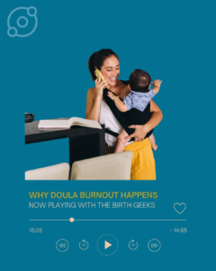 A woman talks on the phone while smiling, holding a baby and working in the kitchen.